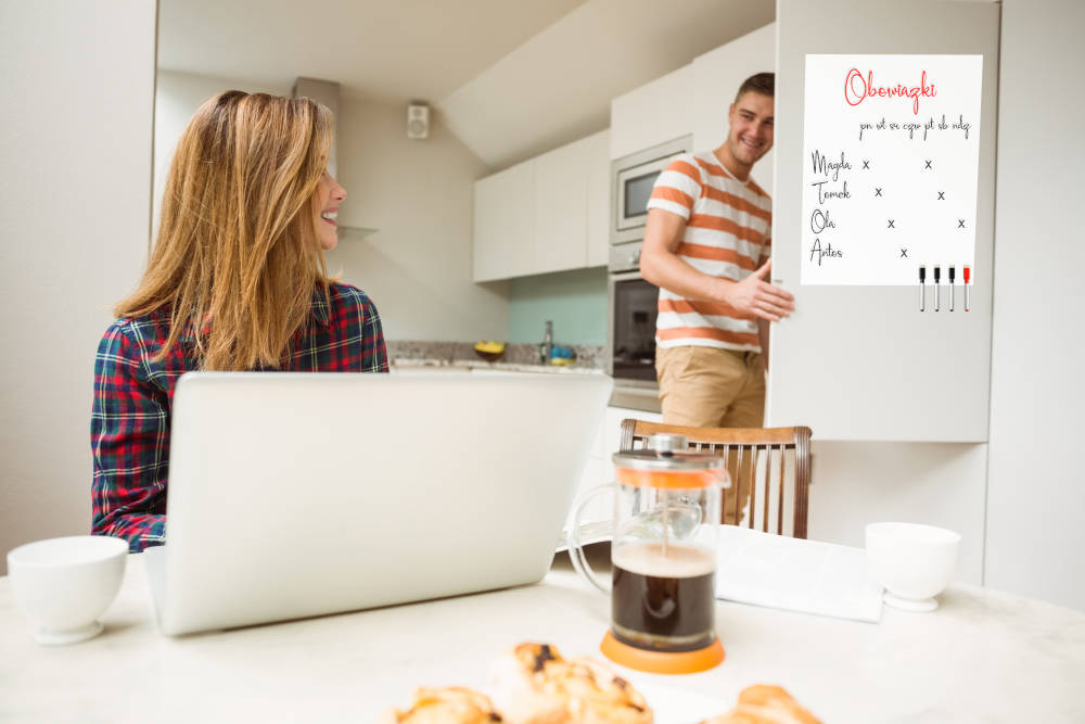 Cute couple spending time together at home in the kitchen